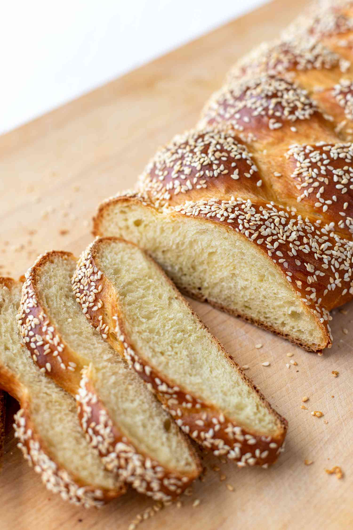 Slices of challah bread topped with sesame seeds