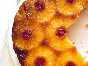Pineapple upsidedown cake with pineapple slices and cherries