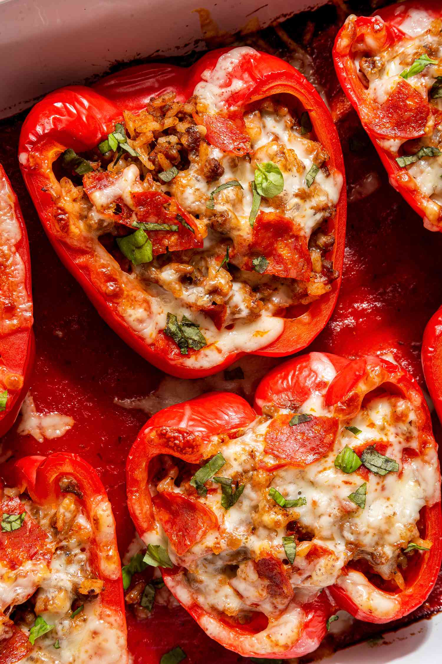 pizza stuffed peppers in a casserole dish (close-up)