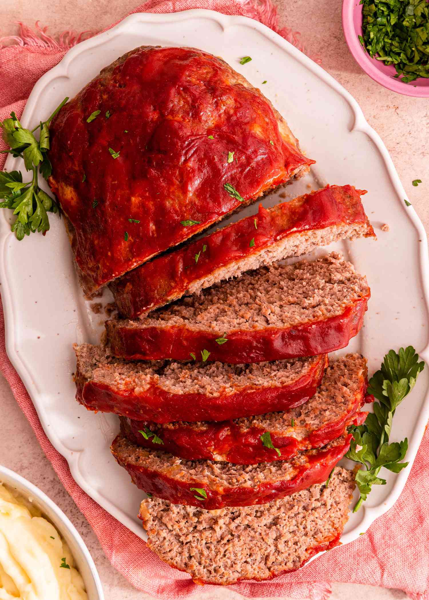 a platter of sliced meatloaf on a table