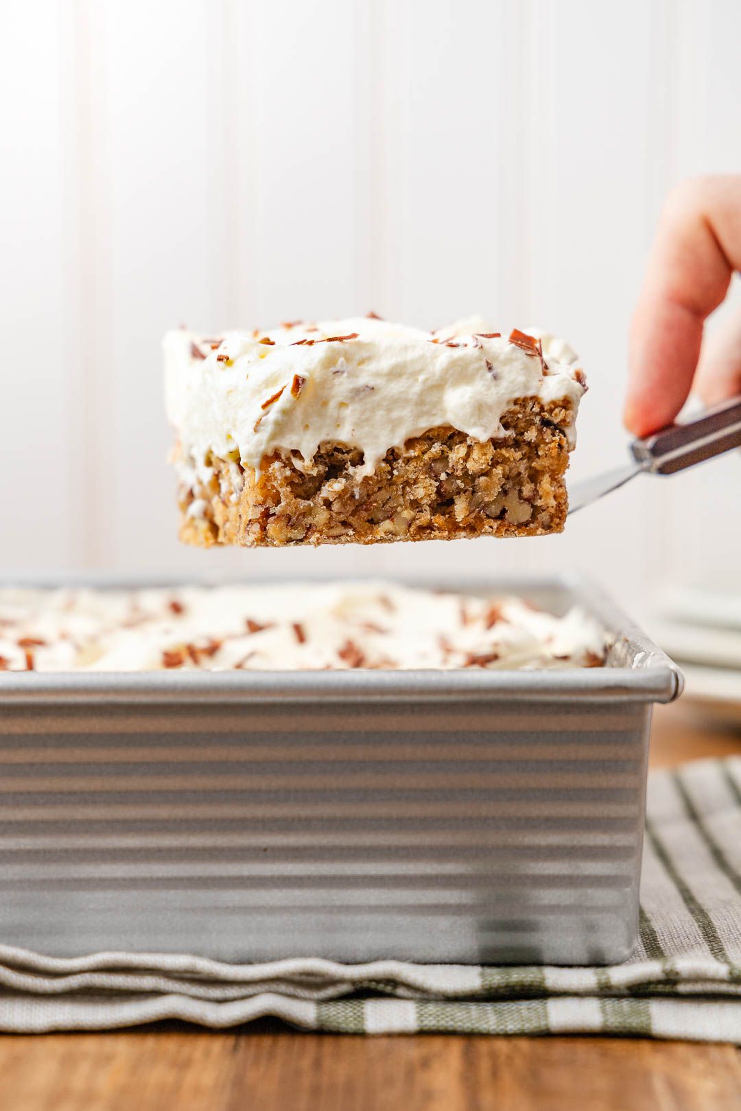 Slice of ritz torte lifted from a baking pan