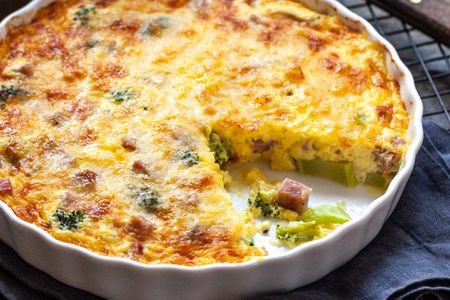 Crustless Quiche with Ham - close up of ham and broccoli quiche in a white dish