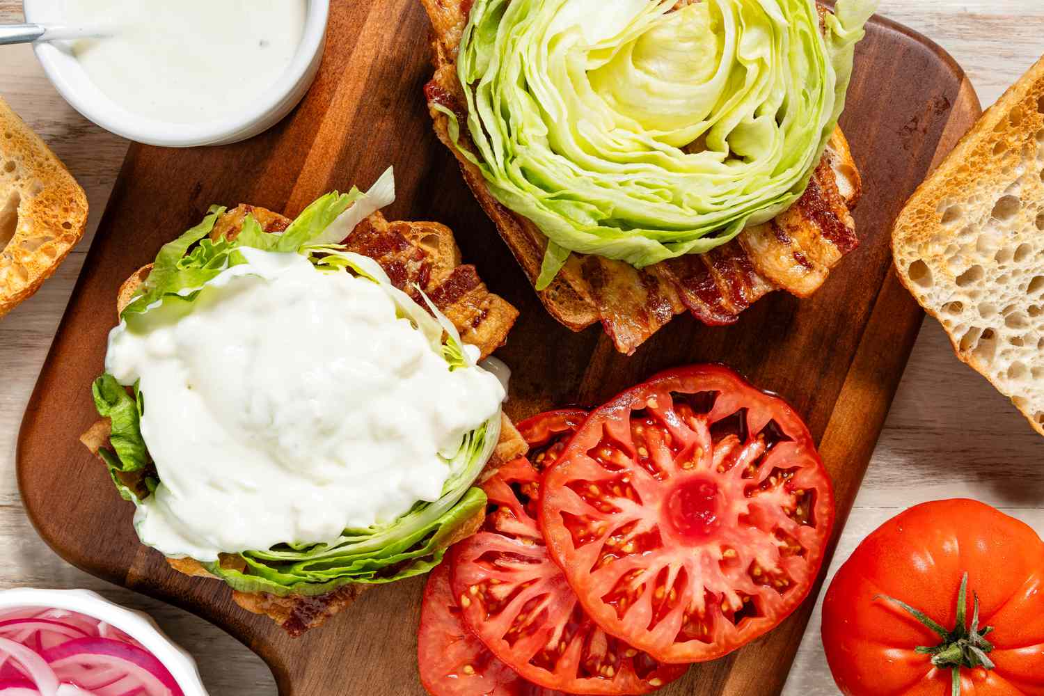 BLT assembled on a wooden board