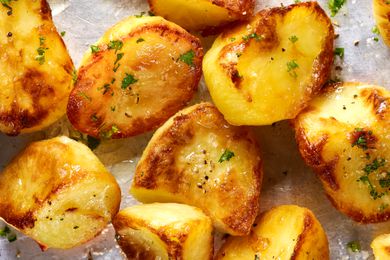 close up - roasted crispy potatoes on a sheet pan