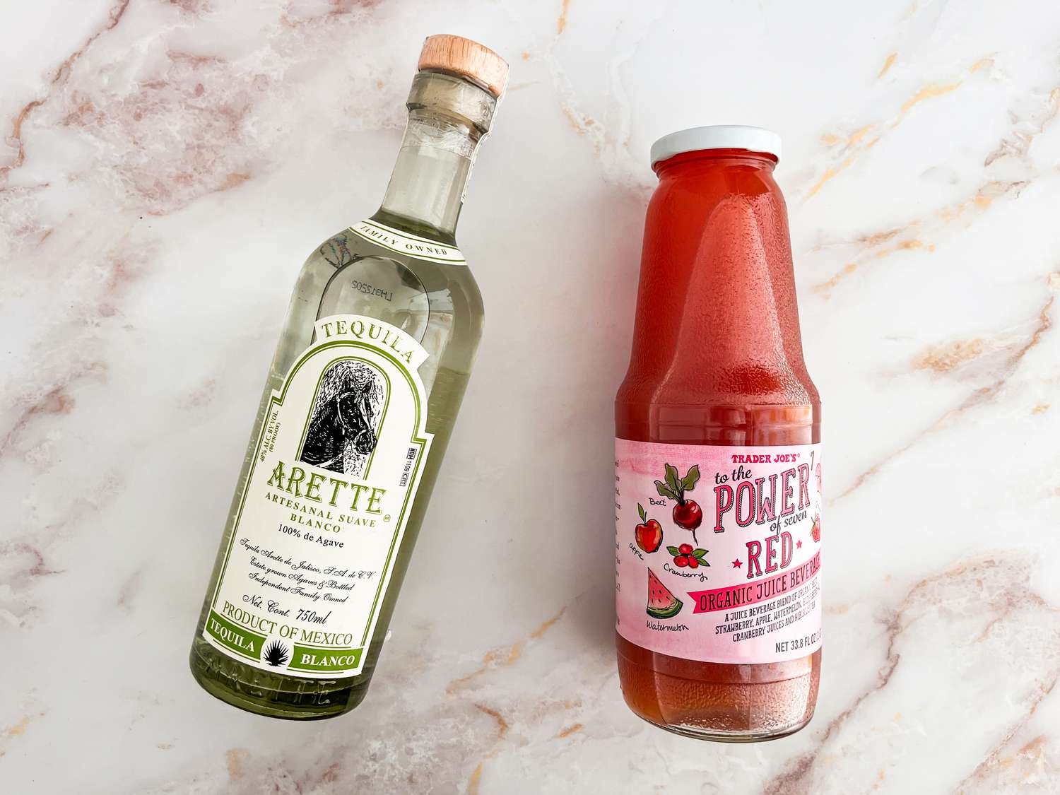 Juice from Trader Joe;s and a bottle of tequila on the counter
