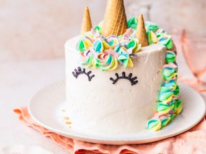 Unicorn Cake on Plate with Kitchen Towel Under the Plate