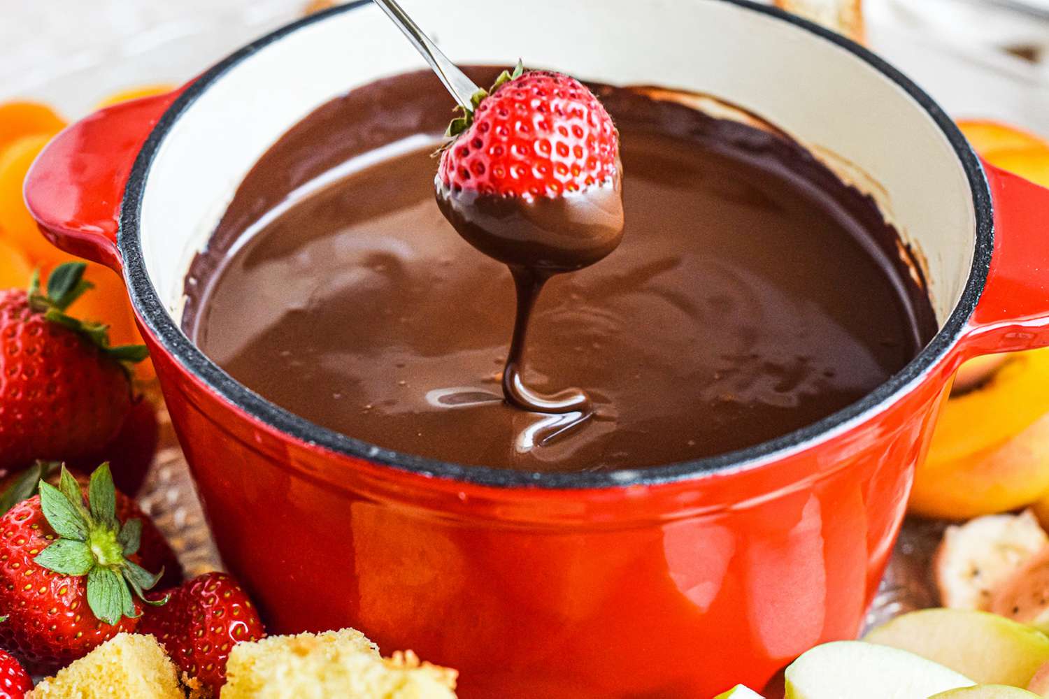 Dipping food into fondue chocolate.