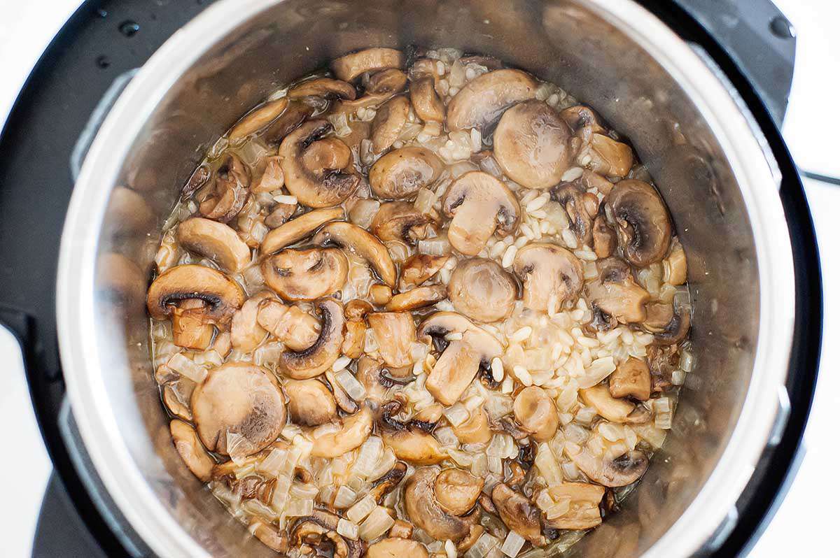 Creamy Mushroom Risotto - photograph of risotto and mushrooms inside the bowl of an instant pot