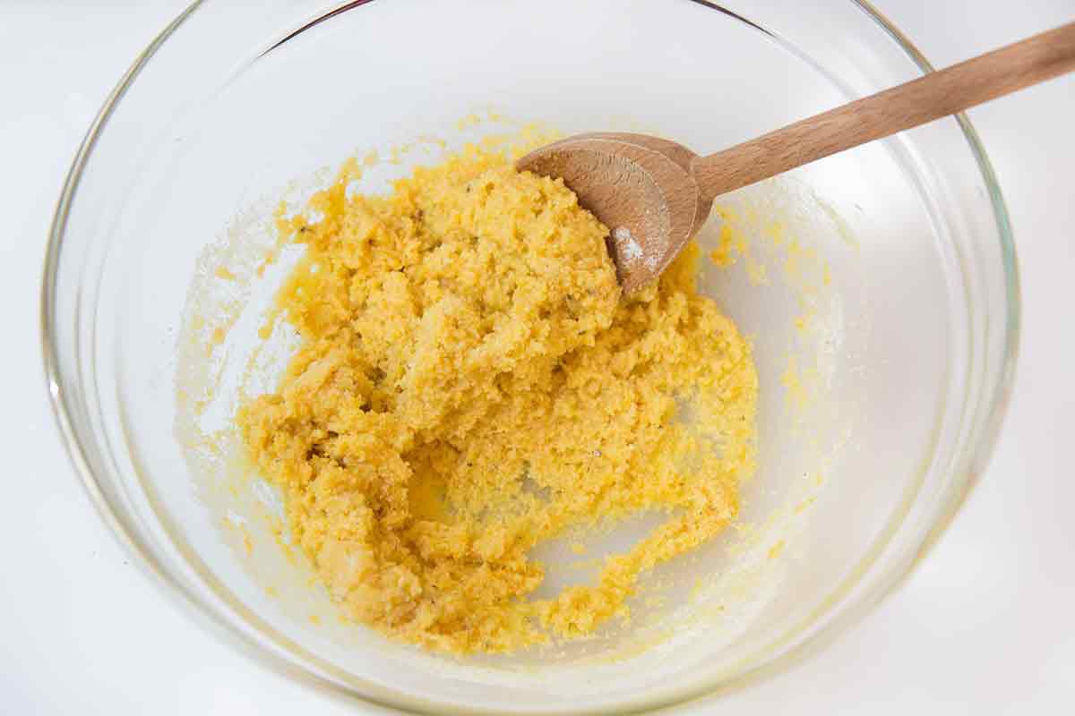 add egg mixture to the almond flour mixture to make the base of the batter for the almond lemon flourless cake