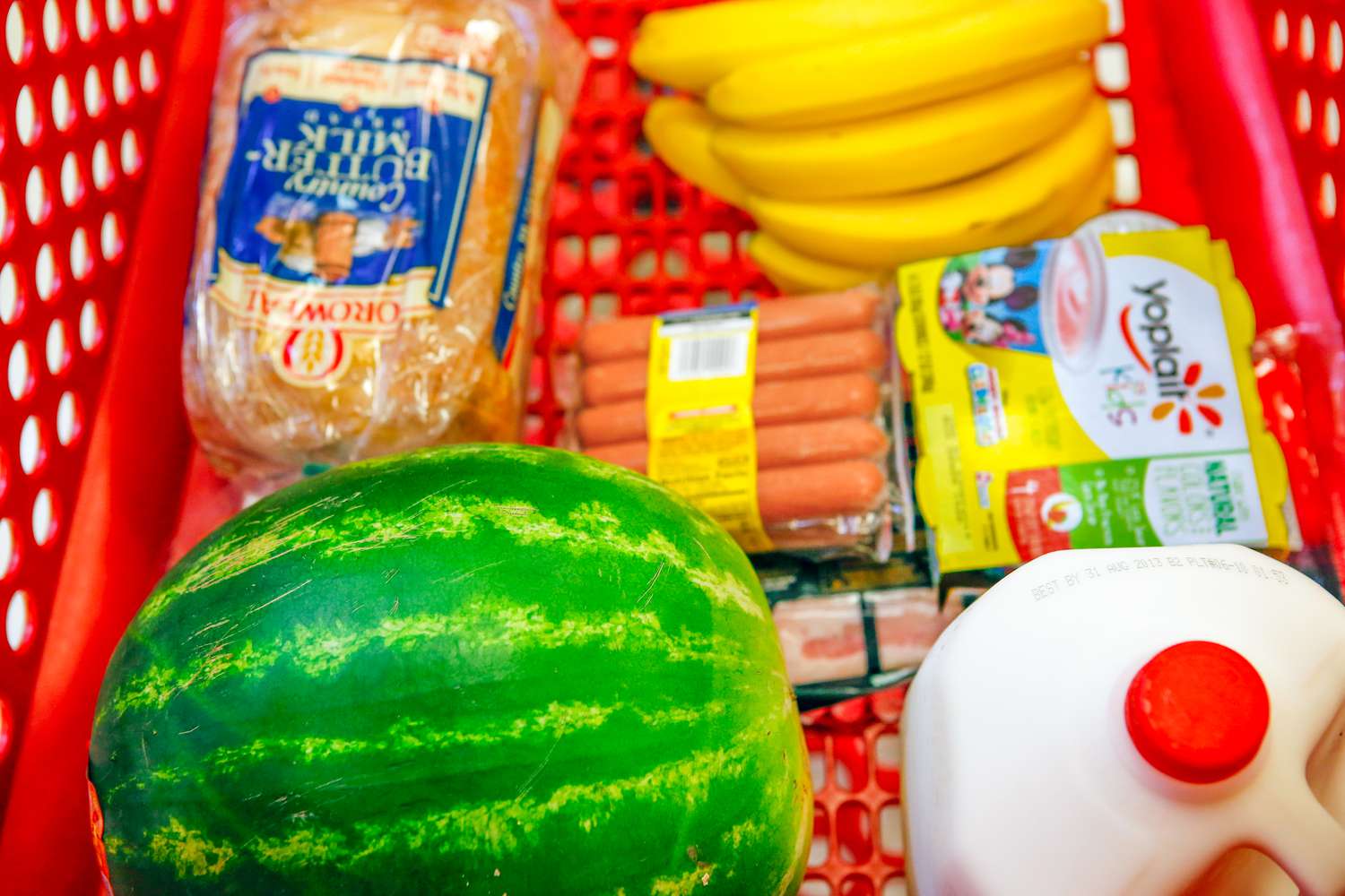 shopping cart filled with grocery essentials