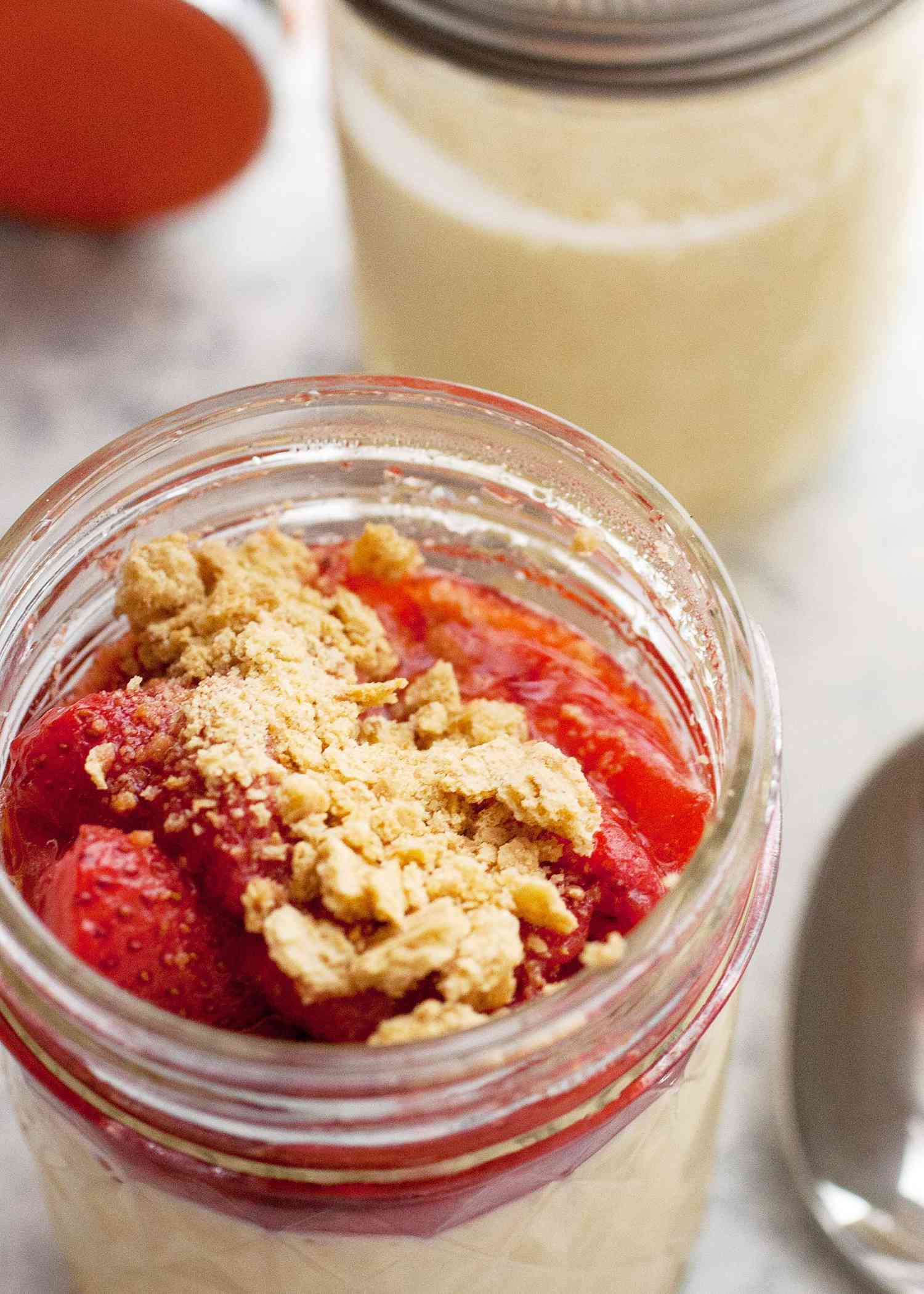 Sous Vide Cheesecake in a jar topped with strawberries