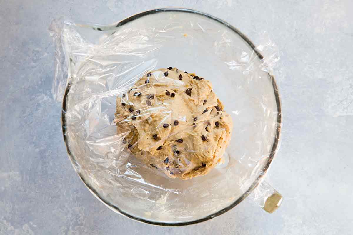 Dough for easy hot cross buns rising in a bowl