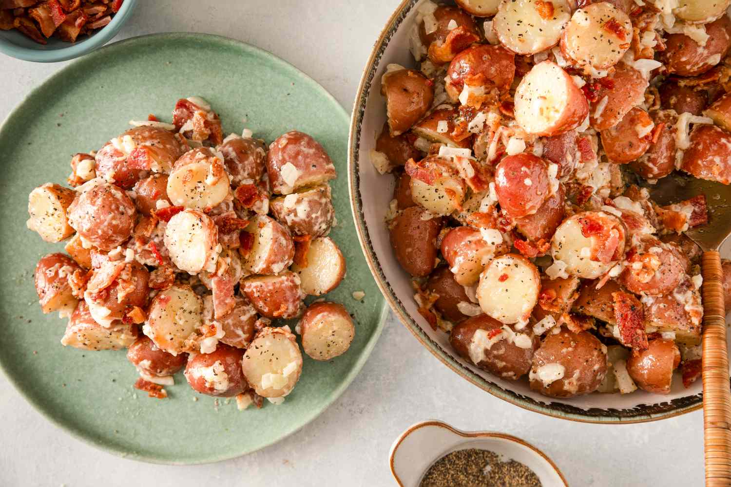 Two plates of bacon potato salad