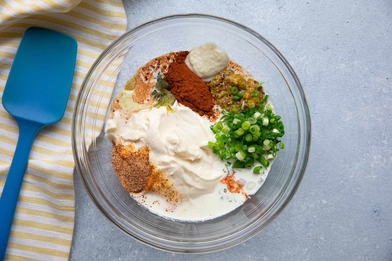 Bowl of Remoulade Ingredients (Mayonnaise, Heavy Cream, Spice, and Scallions) for Oyster Po' Boy Recipe 