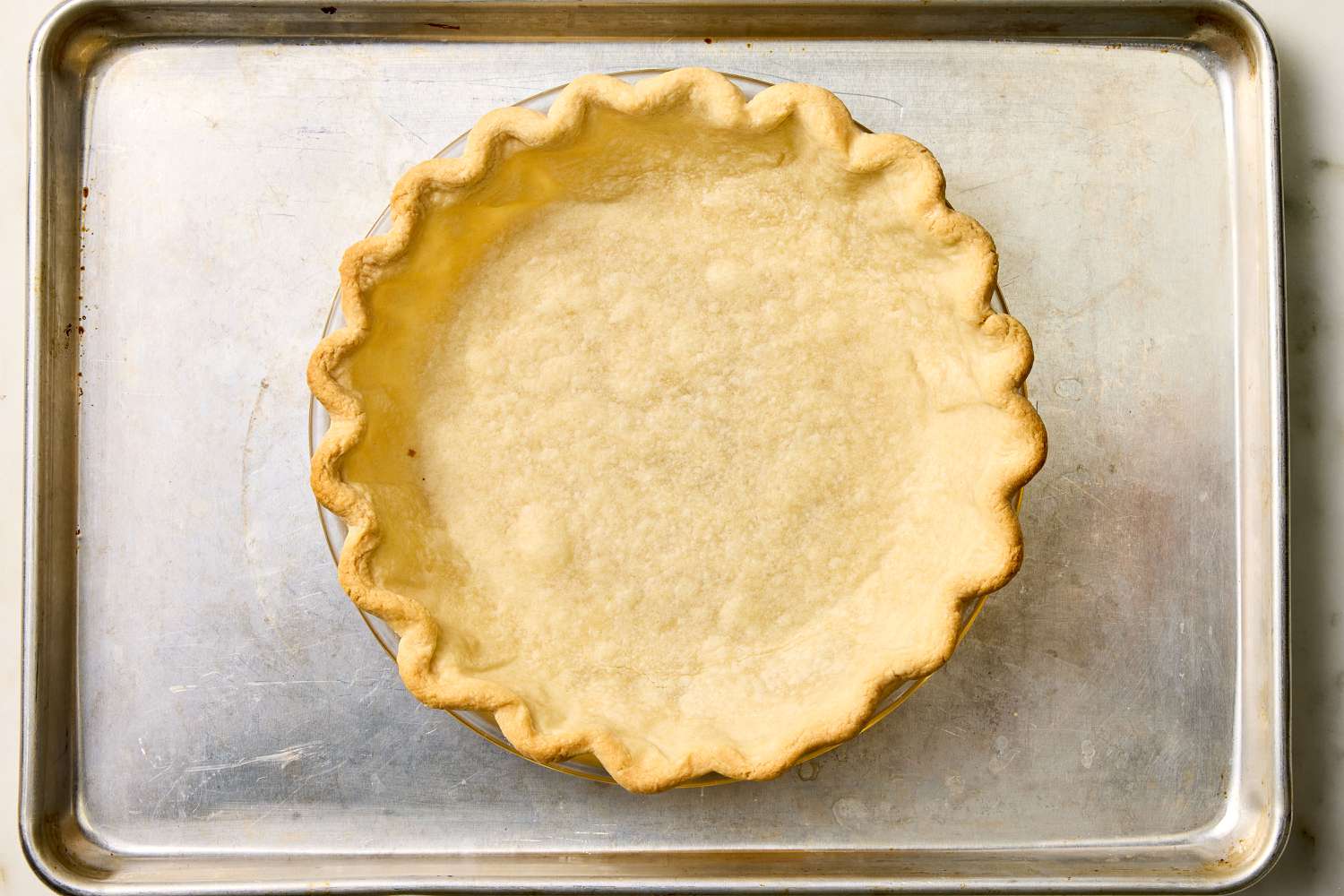 baked pie dough in a pie pan