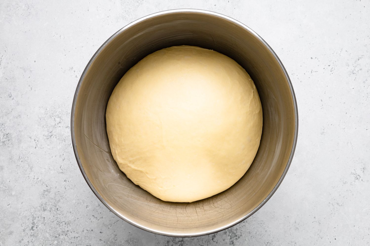 Risen Bee Sting Cake Dough in a Mixing Bowl