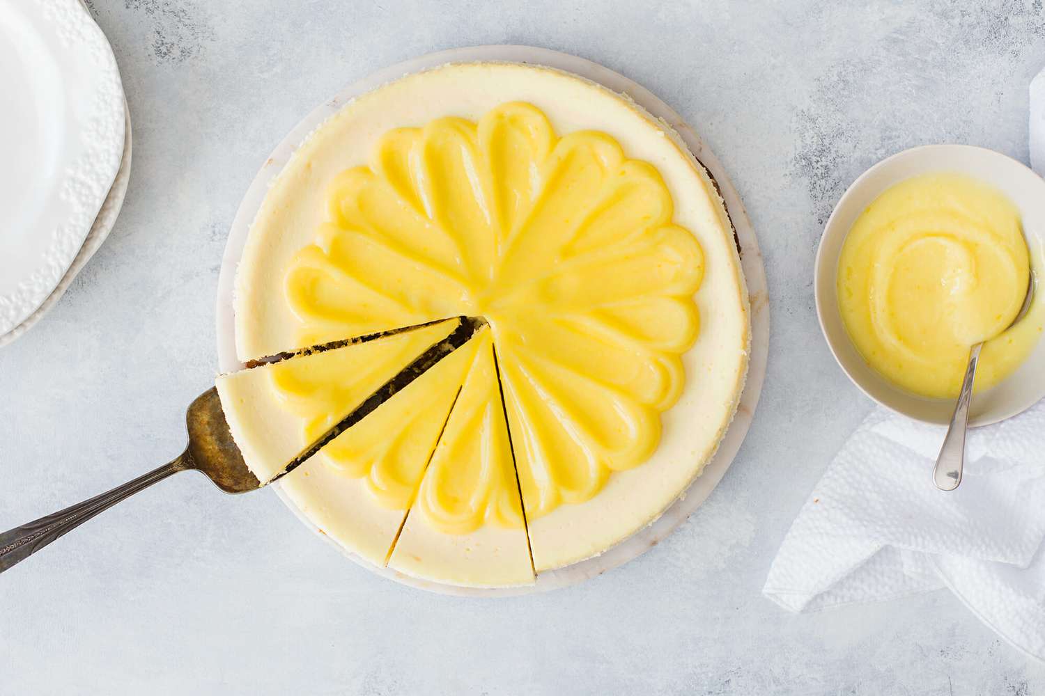 Lemon cheesecake topped with lemon curd