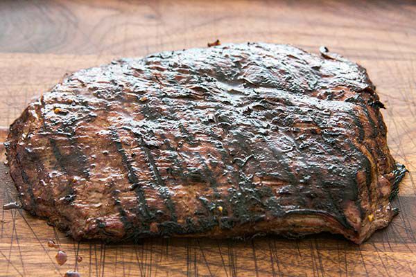 Letting grilled flank steak rest on cutting board