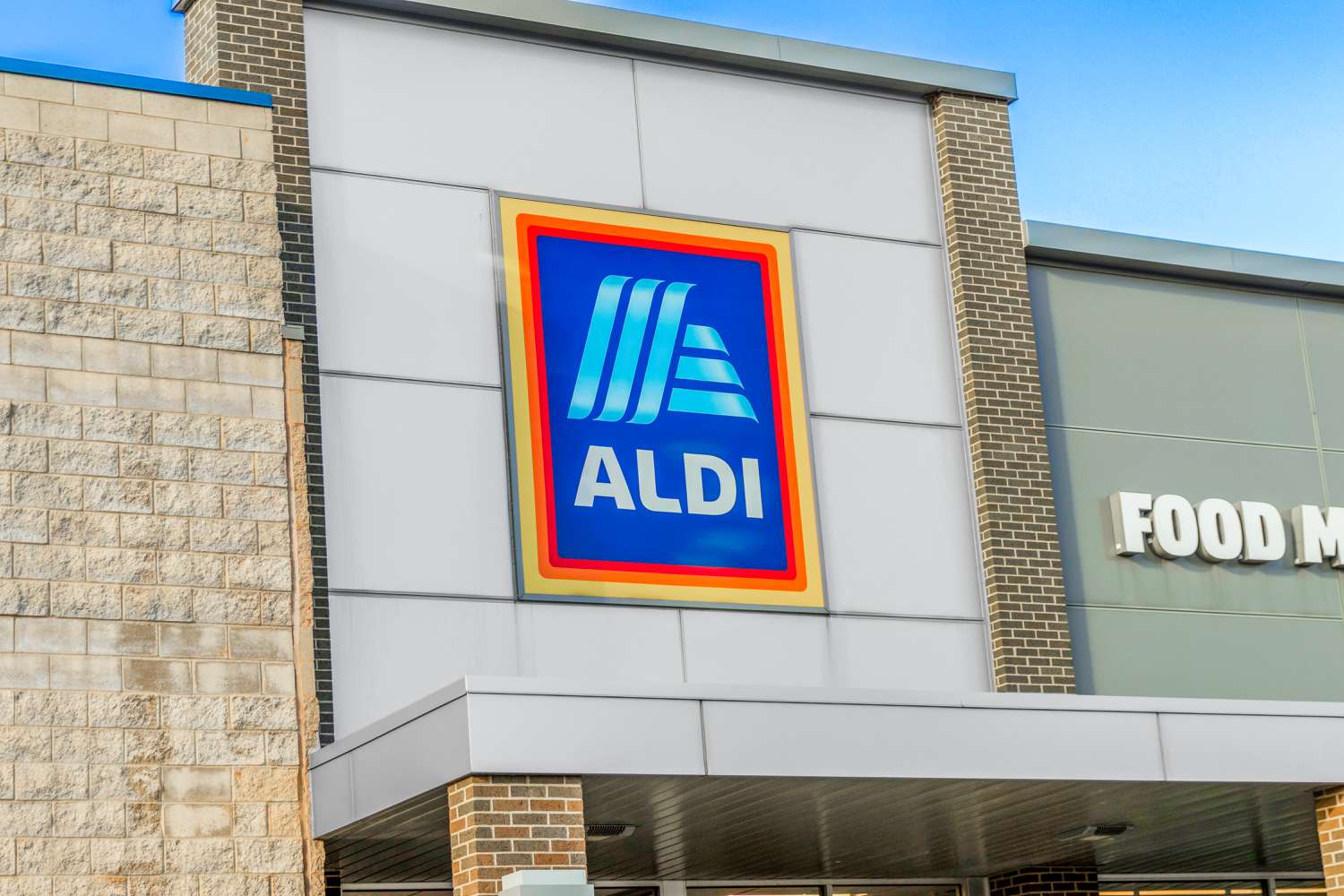 Exterior view of an Aldi supermarket store sign on a building