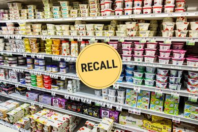 A supermarket aisle displaying yogurt products with a circular yellow recall notice graphic overlayed
