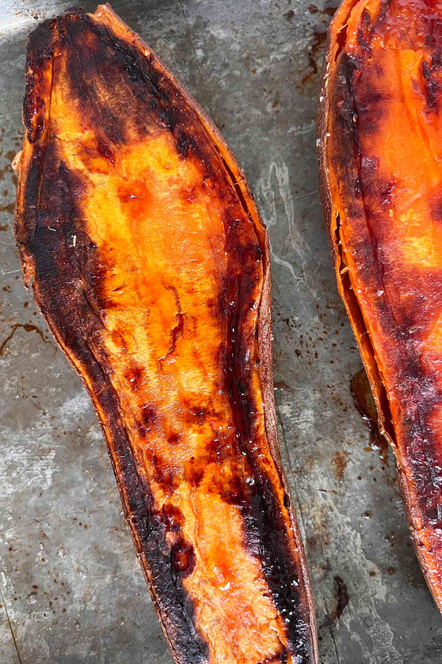 cooked sweet potatoes on a a baking sheet