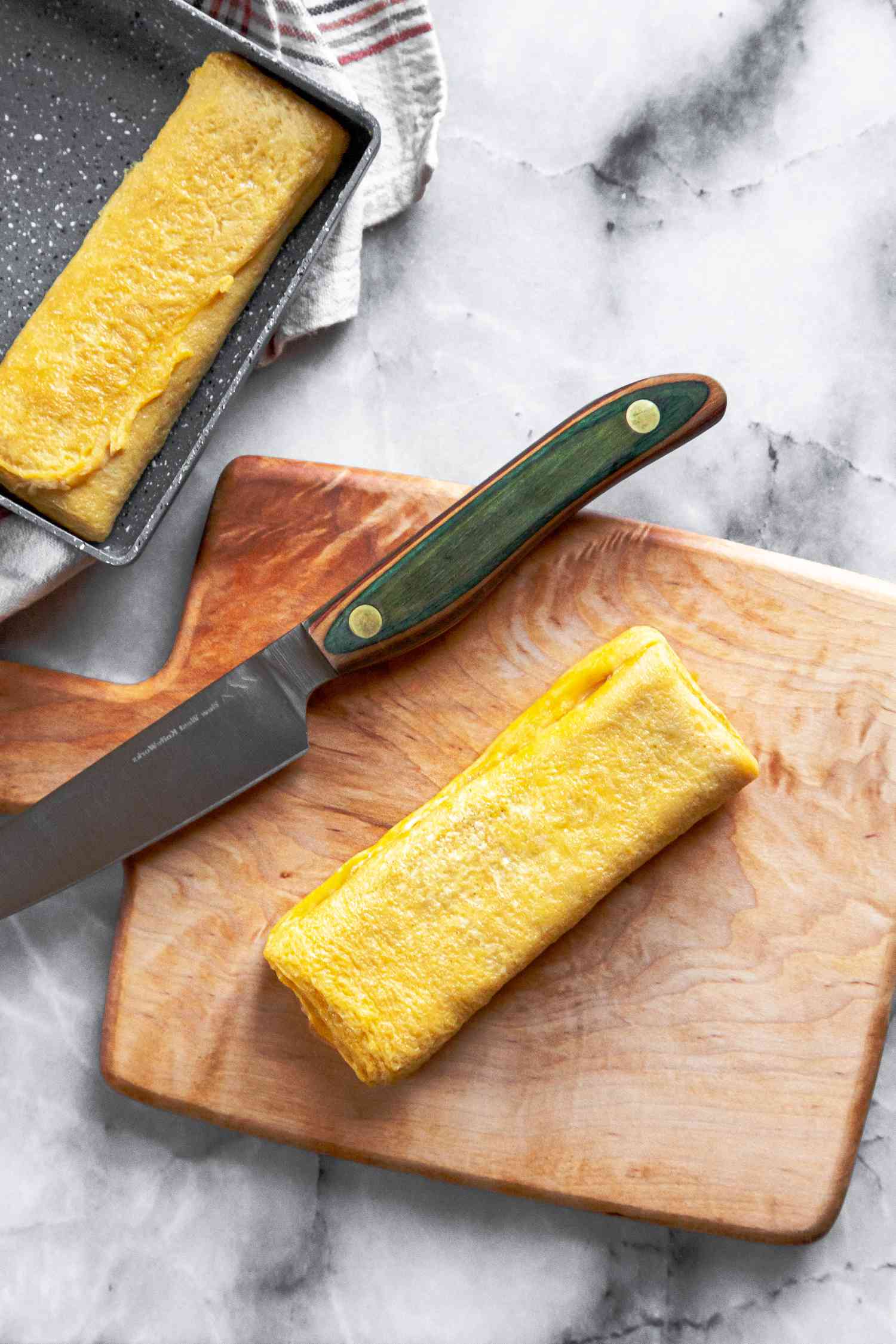 Tamagoyaki on Cutting Board with Knife