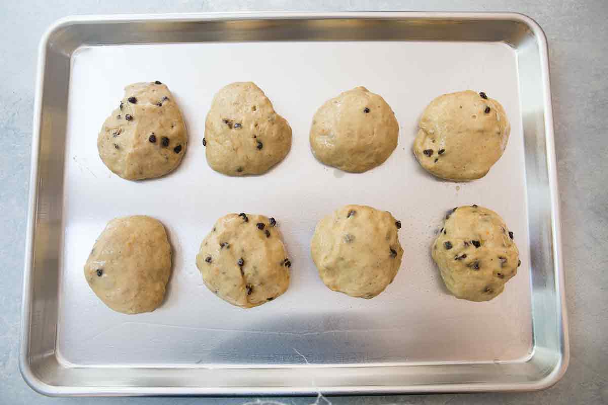 Shaped hot cross buns, risen and ready to go in the oven