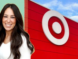Joanna Gaines in front of a large Target store logo and building