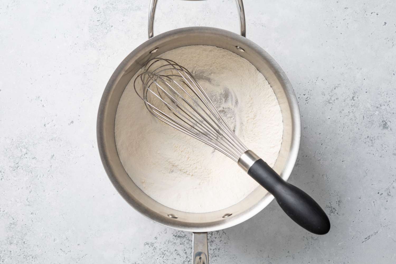 Dry Ingredients Whisked Together in a Sauce Pan for Piña Colada Pie 