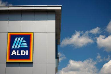 Aldi store with logo against a blue sky with clouds