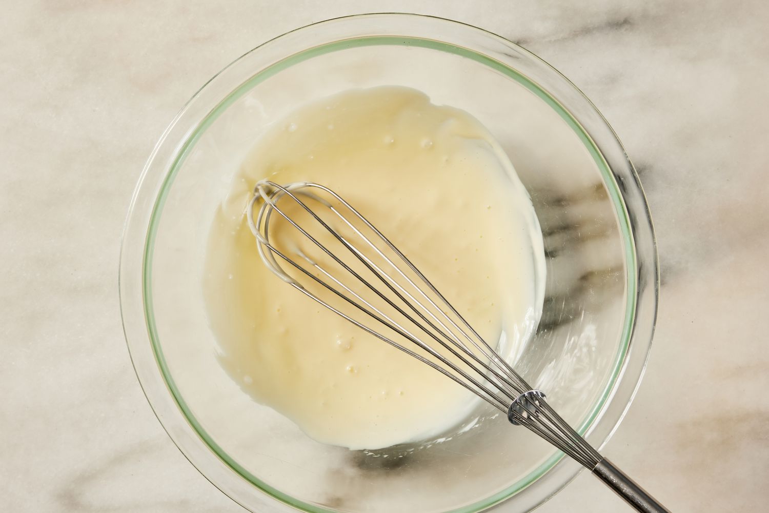 bowl of whisked mayo for Korean-style potato salad recipe