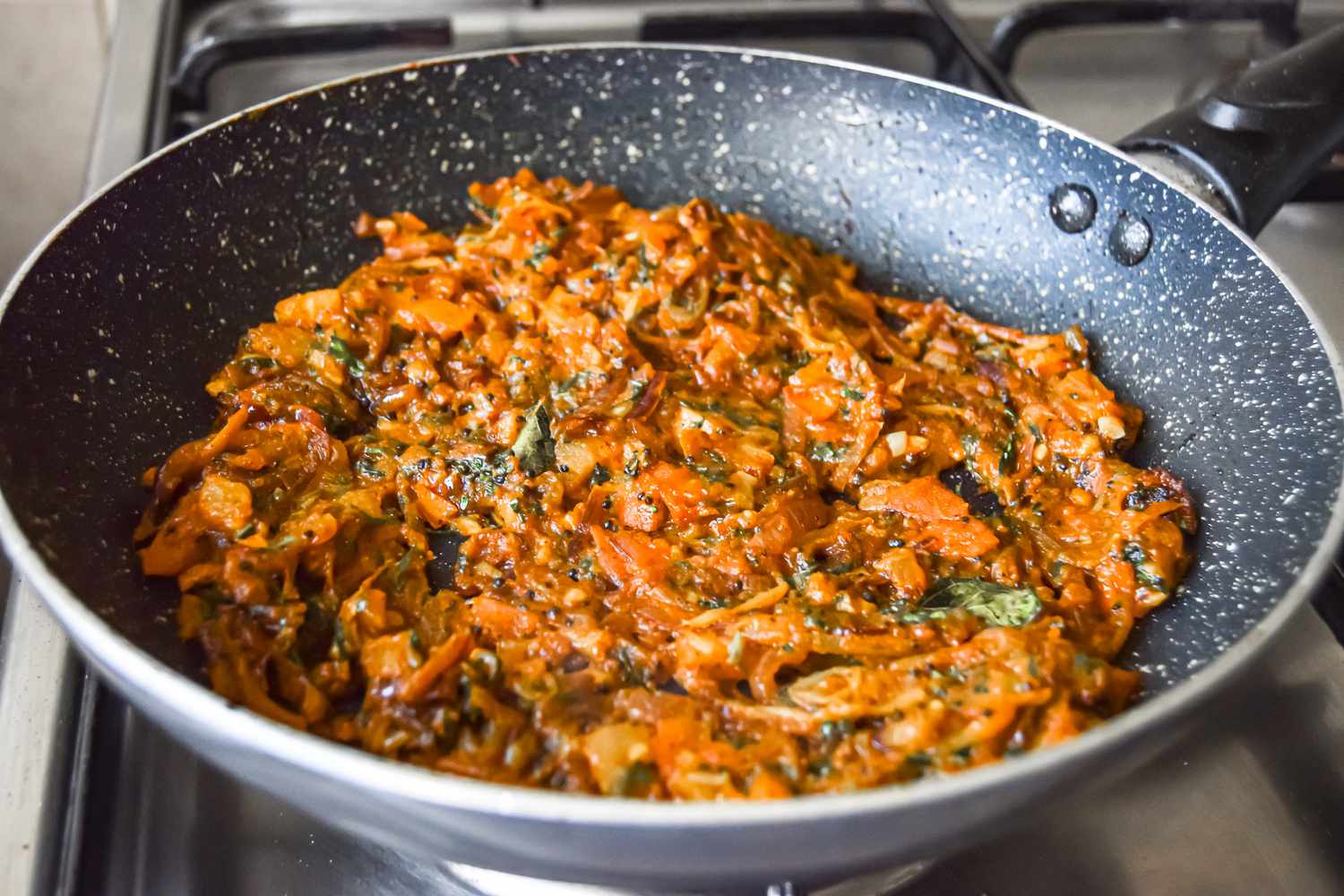 Thick Tomato Masala Paste in a Skillet for Egg Masala Curry