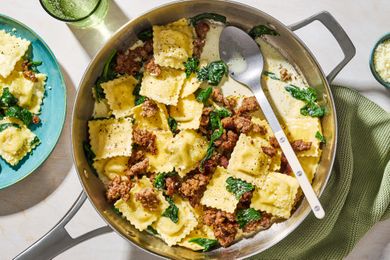 One-Pan Ravioli in a pan with a large spoon