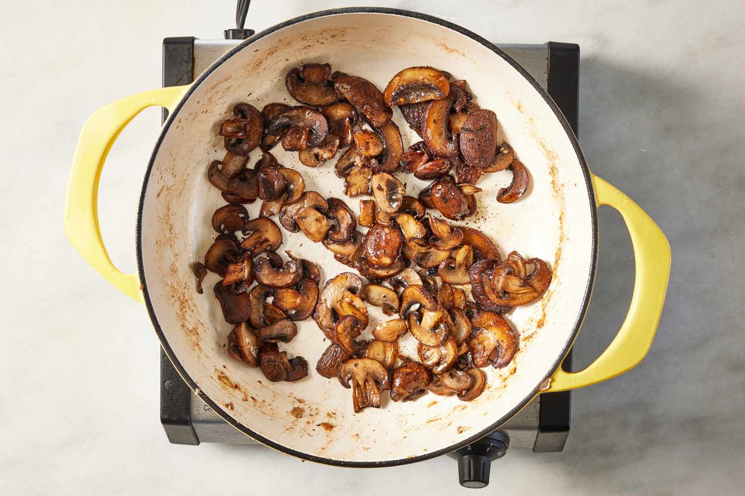 mushrooms cooked in a pot for salisbury ground beef recipe