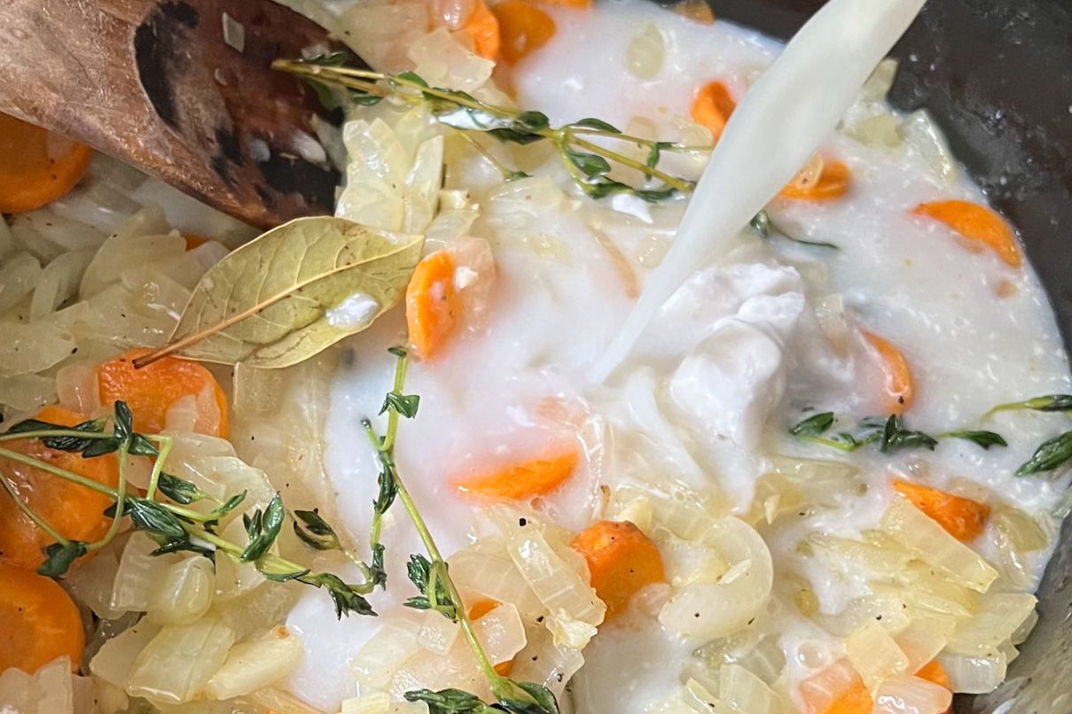 Coconut Milk Added to Soup Base Ingredients for Vegan Butternut Squash Soup 