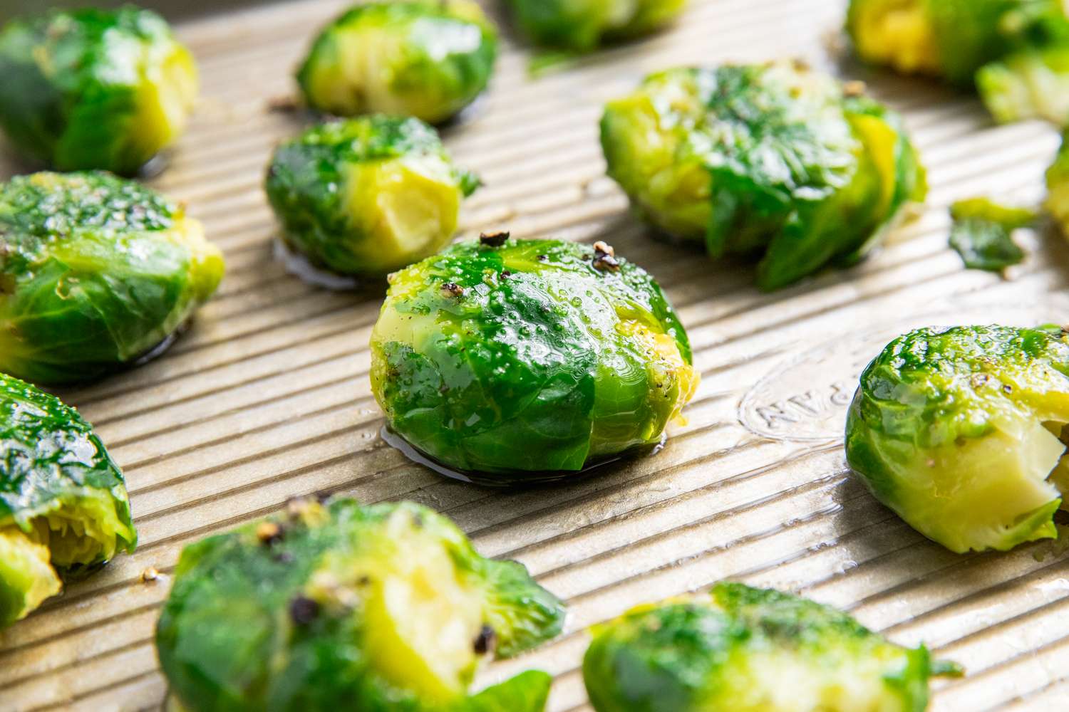 Cooked smashed Brussels sprouts on a baking tray