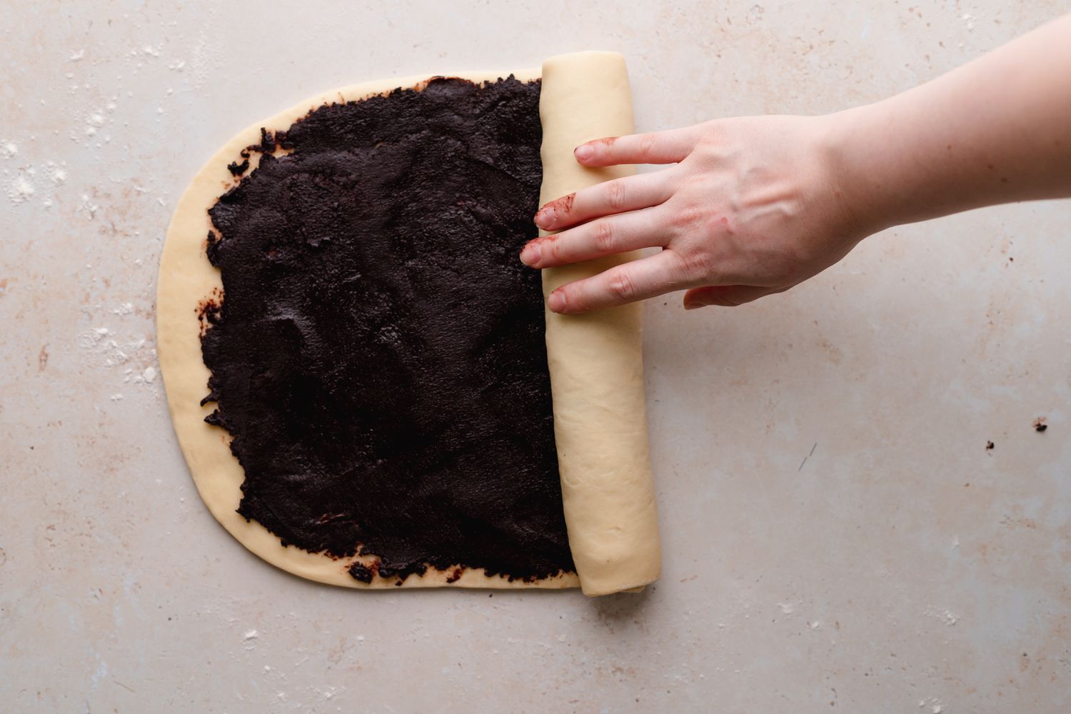 Rolling up dough for semi-sweet chocolate babka.