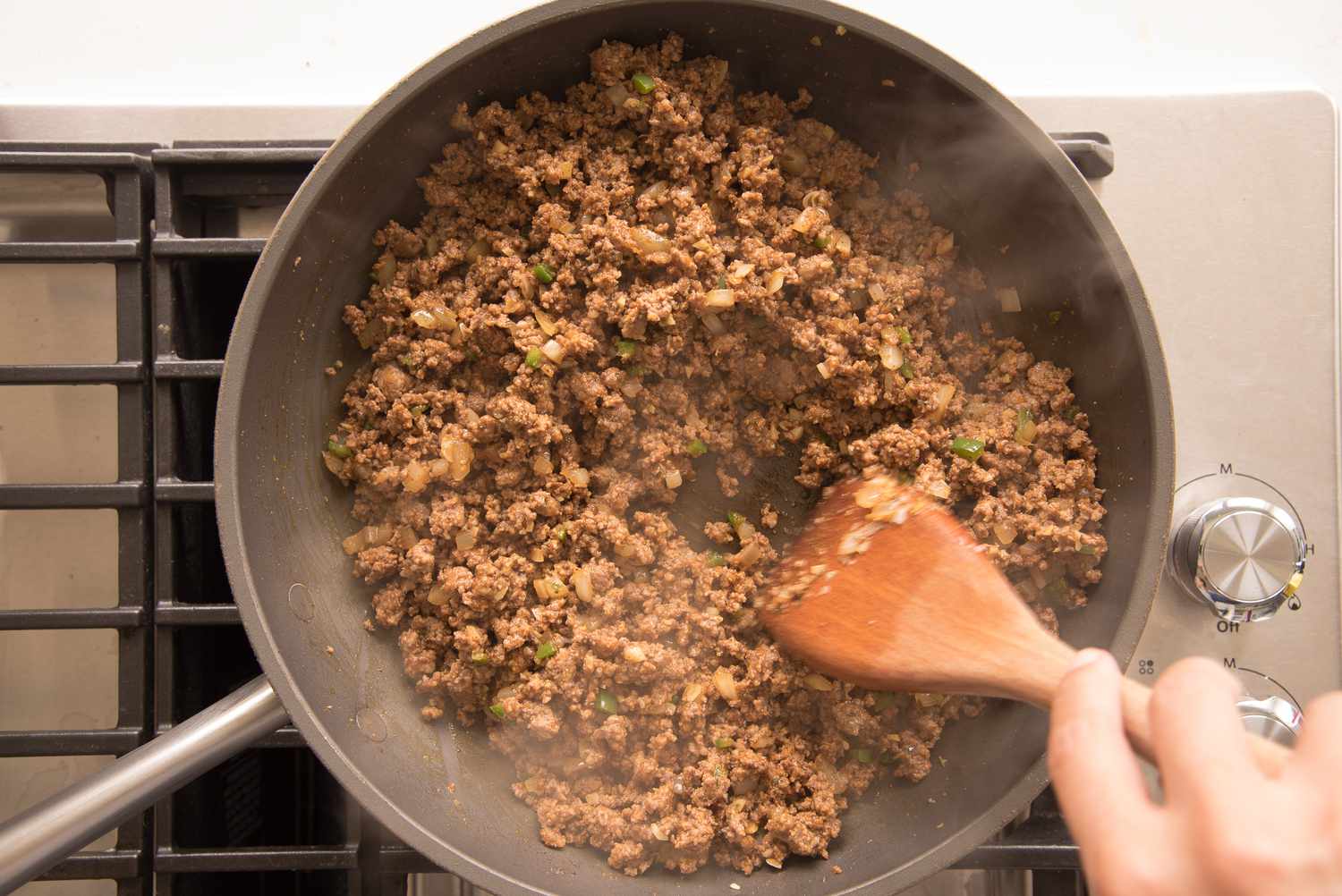 Beef Enchilada Casserole Ground Beef Seasoned and Stirred in Skillet 