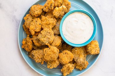 Plate of Fried Pickles Served with a Bowl of Dressing