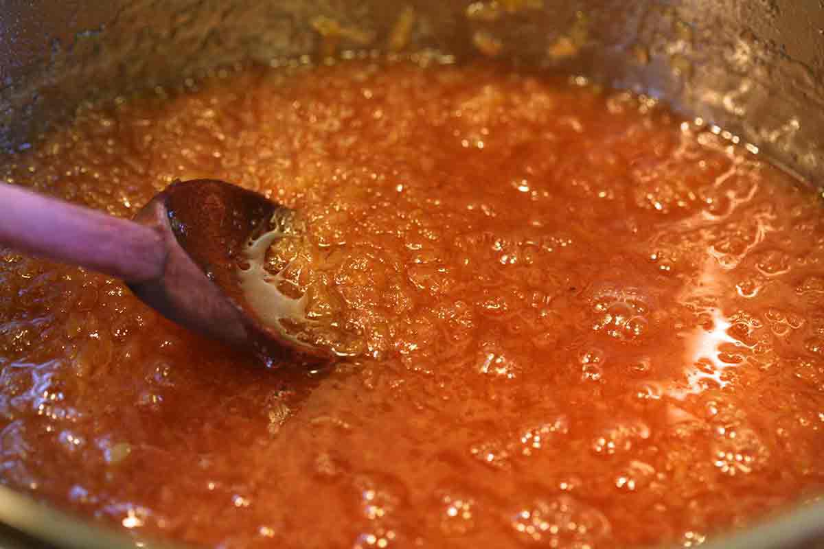 cook quince until it turns rosy red