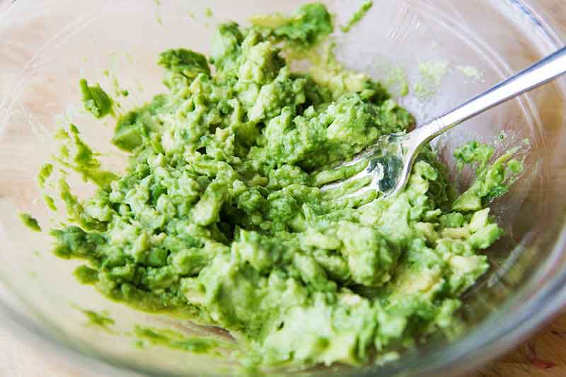 How to make guacamole - smashing avocado with fork