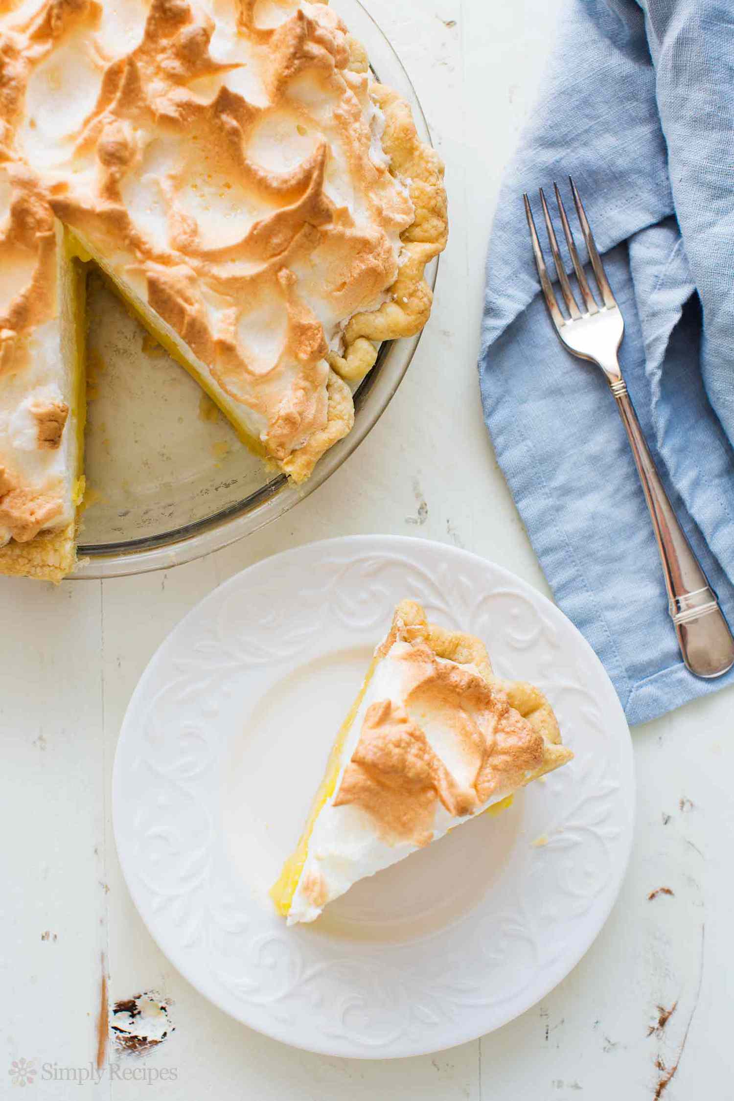 Best Lemon Meringue Pie with slice on plate