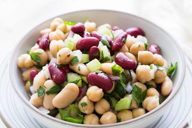 A three bean salad in a white bowl