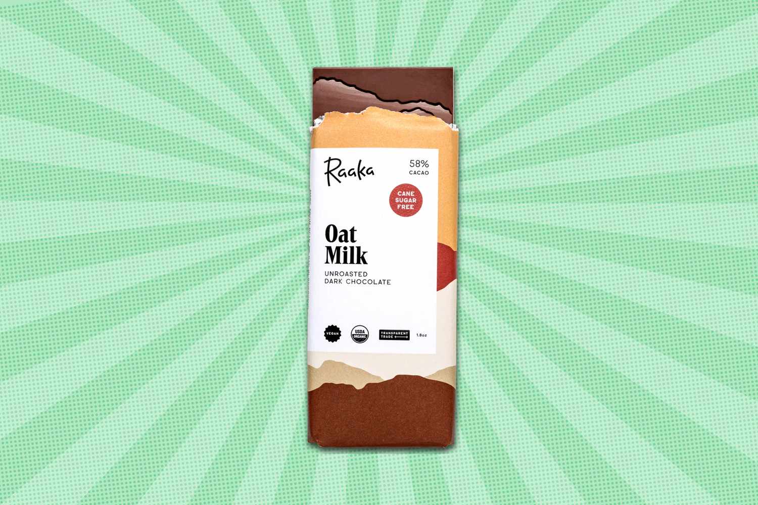 A bar of Raaka Oat Milk dark chocolate with a decorative background