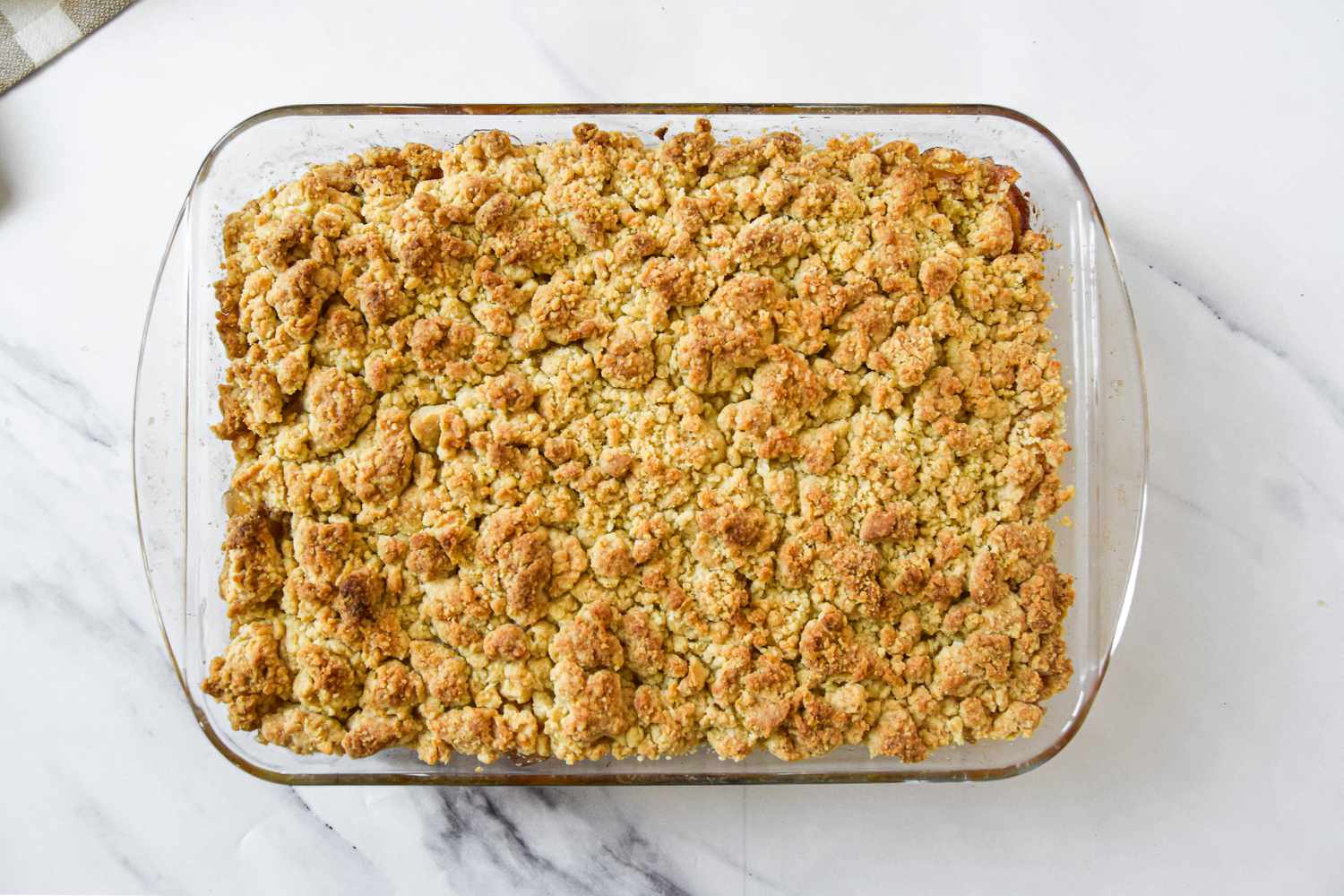 Baked Peach Cobbler in a Pyrex Baking Dish