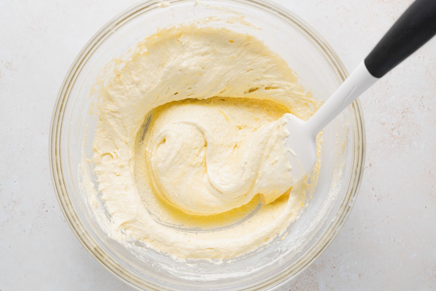 Stirring batter for lemon buttercream macarons.