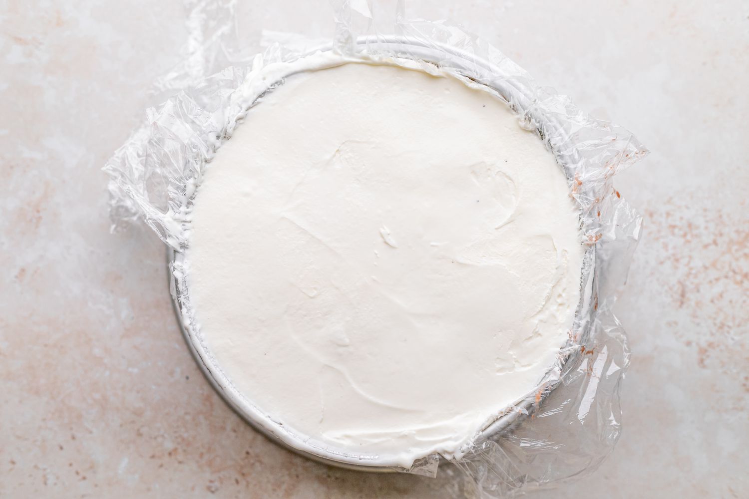 Vanilla Ice Cream Layer Added to Cake in Pan