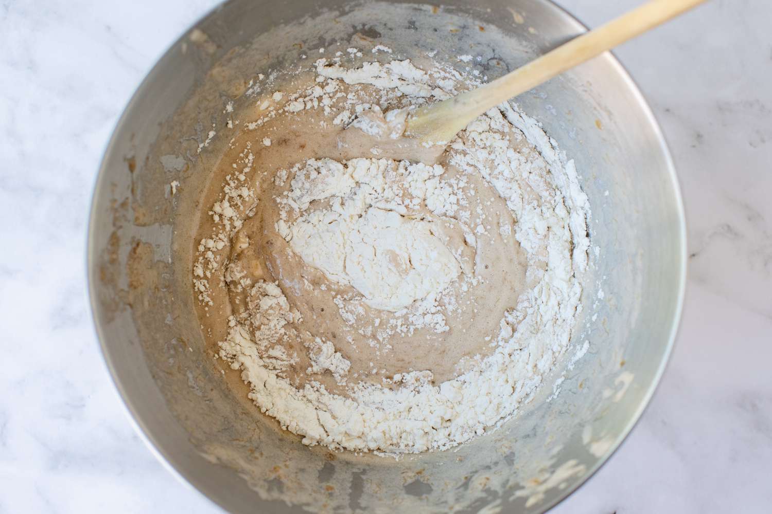 Whisking dry ingredients into wet to make Banana Muffin batter