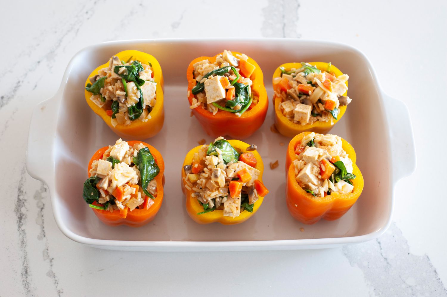Vegetarian Stuffed Peppers in casserole dish