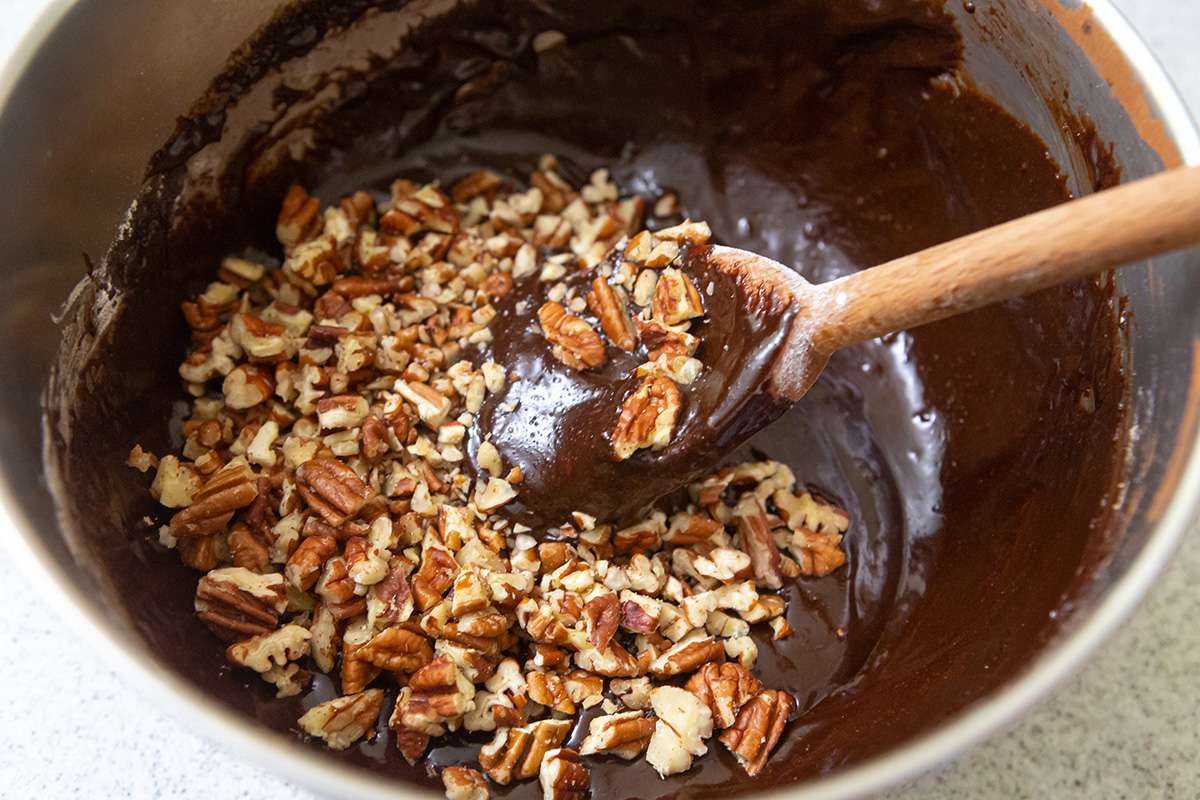 Nuts added to batter for a brownie recipe.